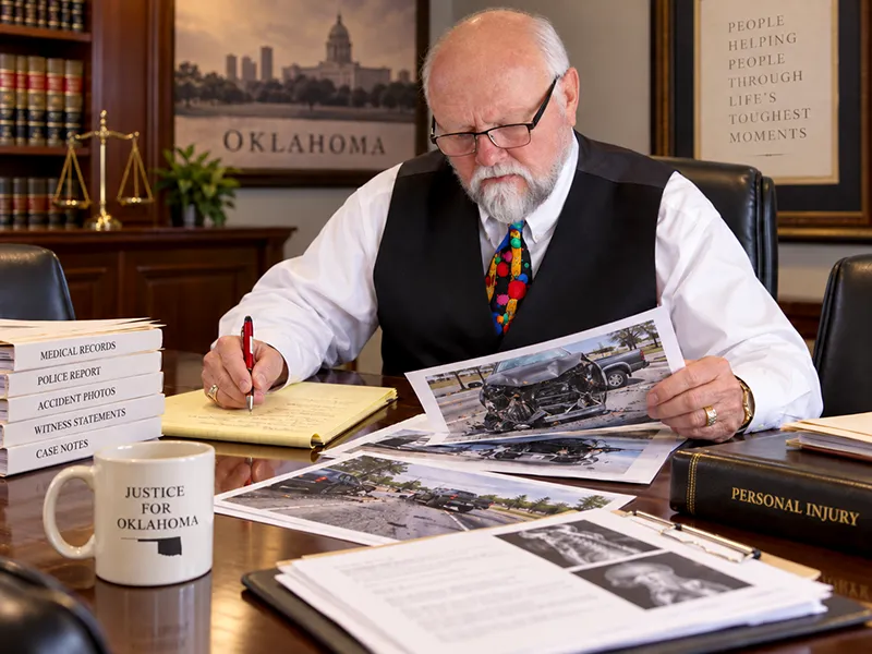 James Self reviewing evidence from a serious Oklahoma car accident case